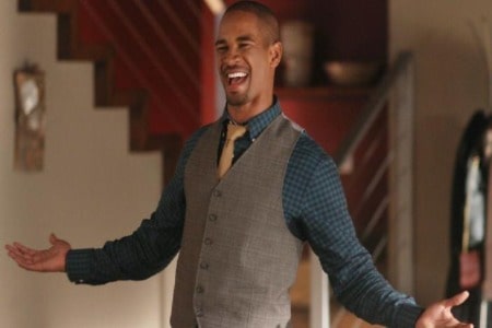 He is posing for a picture.